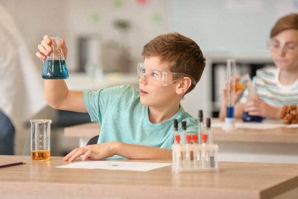Pupil at chemistry lesson in classroom - Photo, Image