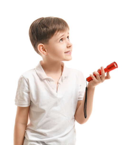 Little boy with flashlight on white background - Photo, Image