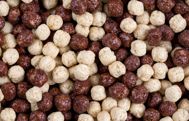Background of round corn balls a milk and chocolate flavor - Foto, afbeelding