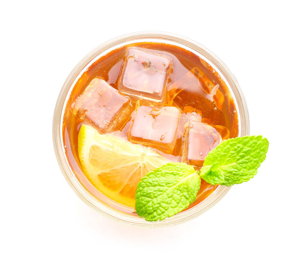 Glass of tasty cold ice tea on white background - Photo, Image