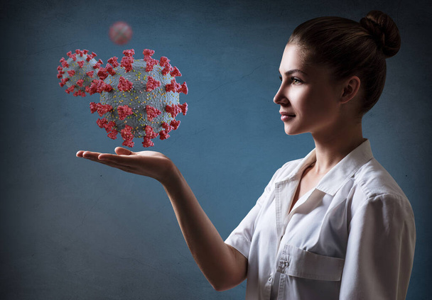 Жінка-лікар представляє вірусну клітину коронавірус
. - Фото, зображення