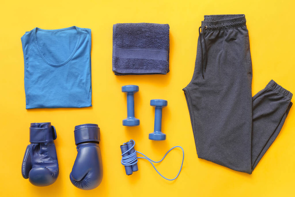 Composition with sportswear on color background - Photo, Image