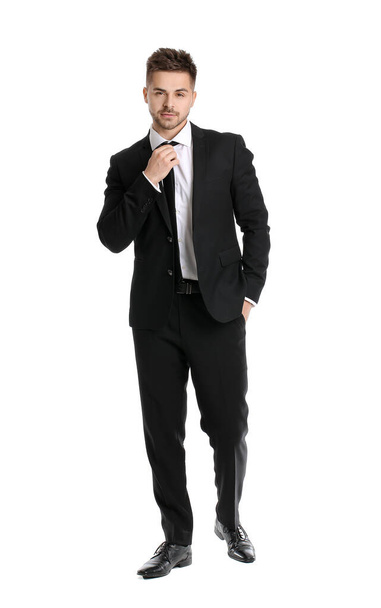 Portrait of handsome young businessman on white background - 写真・画像