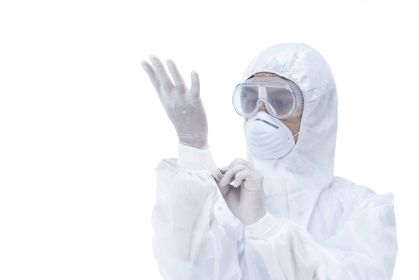 a doctor wearing protective suit to fight coronavirus pandemic covid-2019 on white background. - Фото, изображение