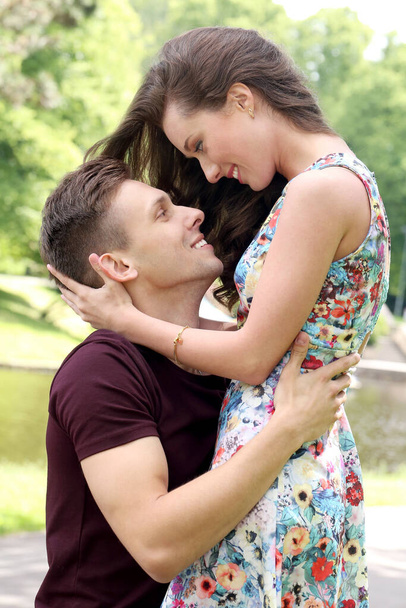 Cute, young couple in the park - Photo, Image