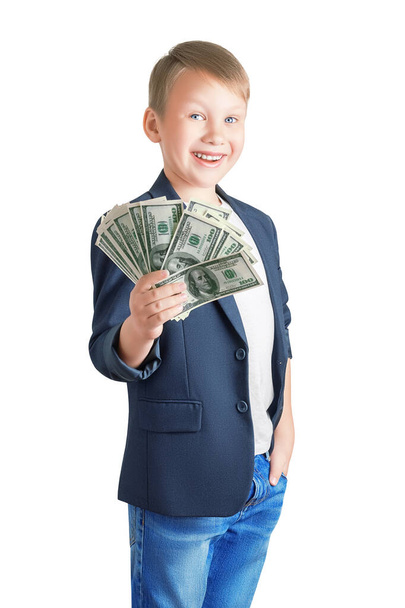 Cute happy eight year old boy holding a fan of hundred dollar bills and smiling isolated on a white background. Successful businessman, winner, lucky concept - Foto, imagen
