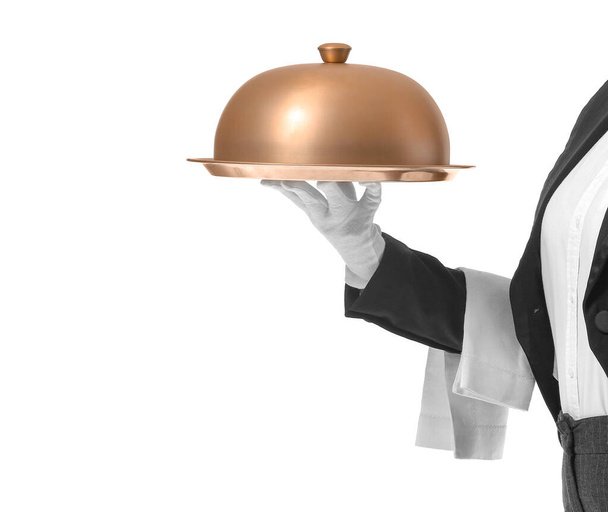 Beautiful female waiter with tray and cloche on white background - Photo, Image