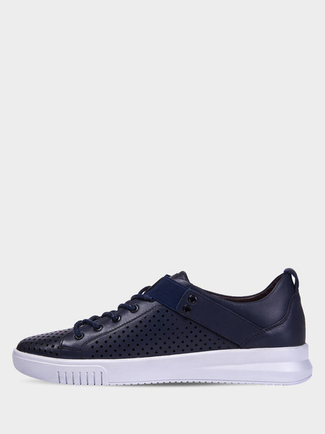 Men's summer leather blue sneakers with perforation and white sole. Men's sports shoes. Sport style. Isolated on a white background. - Photo, Image
