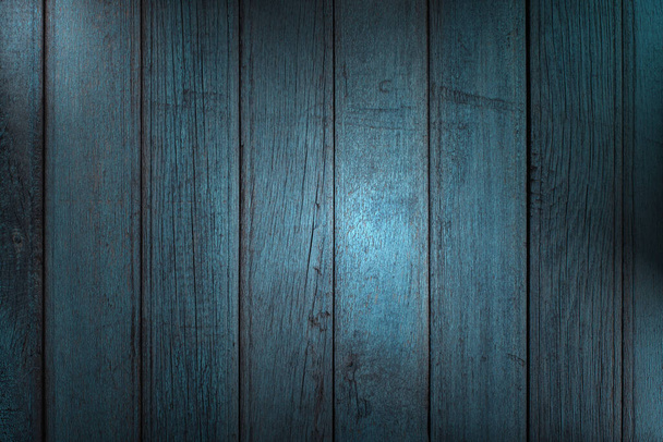 Vertical wooden planks with peeling blue paint, creative lighting and copy space. Abstract trendy wooden natural texture background - Φωτογραφία, εικόνα