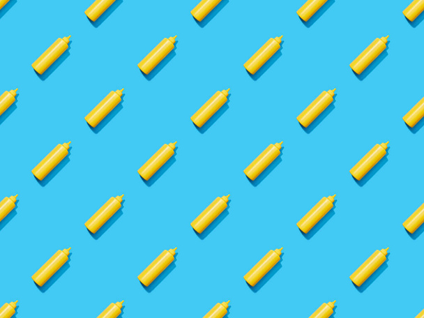 bottles of mustard on blue colorful background, seamless pattern - Foto, imagen