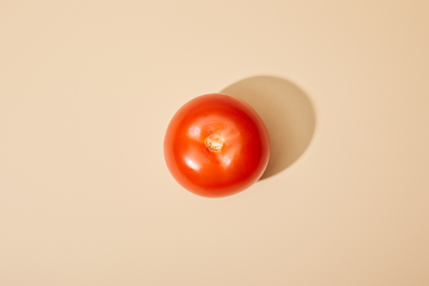 top view of ripe fresh tomato on beige background - Zdjęcie, obraz