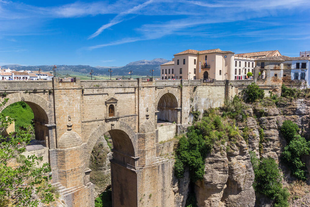 Historic buildings at the Puente Nuevo bridge in Ronda, Spain - Zdjęcie, obraz
