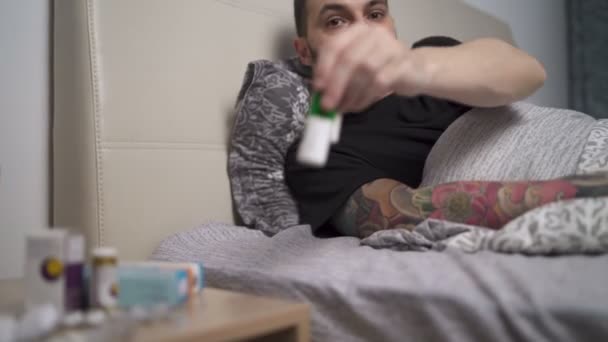 Coughing man taking his medicines during home quarantine - Filmagem, Vídeo