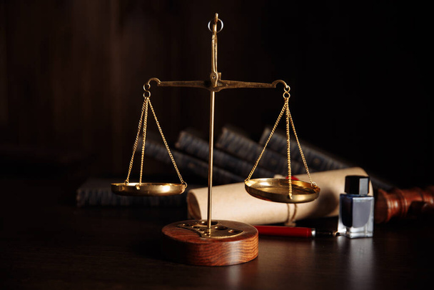 Attorney and notary concept. Wooden gavel on the table and libra - Photo, Image