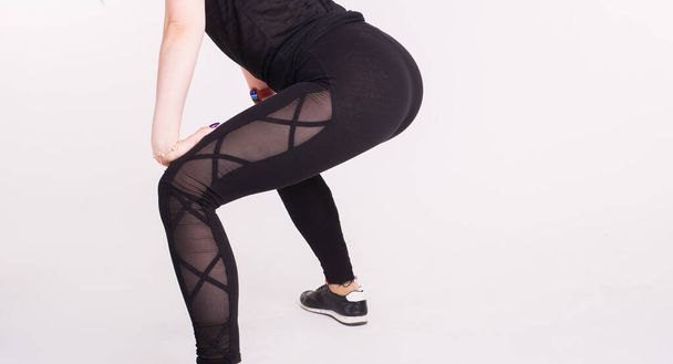 Close-up of girl dancing twerk in the dance class on white background - Photo, Image