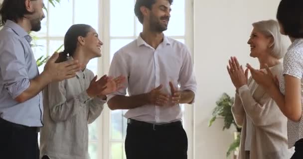 Smiling proud glad employees praising encouraging team leader. - Footage, Video