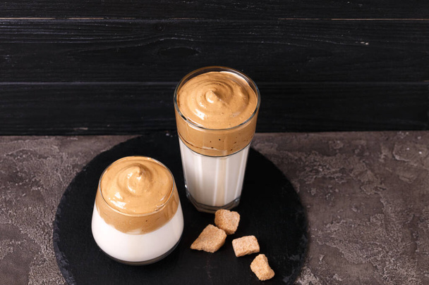 whipped dalgona coffee with milk and cane sugar. trendy South Korean cold summer drink - 写真・画像