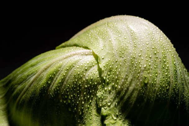 close up view of wet fresh cabbage leaves isolated on black - Фото, зображення