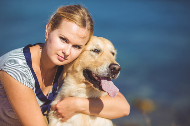 Young woman, labrador dog, sea - Φωτογραφία, εικόνα