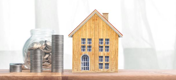 Inversión inmobiliaria e hipoteca hipotecaria financiera conceptmoney pila de monedas. casa de negocios idea - Foto, imagen