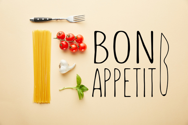 flat lay with delicious spaghetti with tomato sauce ingredients on yellow background with bon appetit illustration - Fotó, kép
