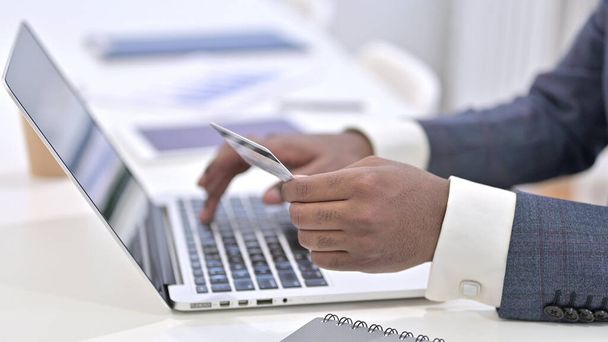 Close up of African Man making Online Payment on Laptop - Fotografie, Obrázek