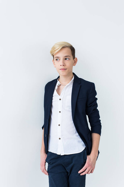 Puberty concept - Teenage boy portrait on a white background. - Fotó, kép