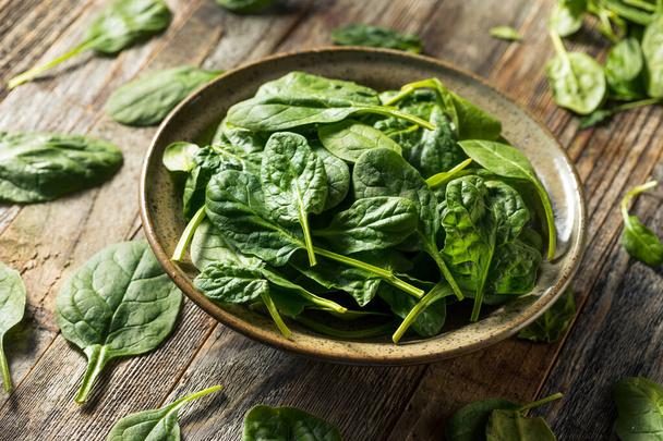Raw Organic Fresh Baby Spinach in a Bowl - Fotó, kép
