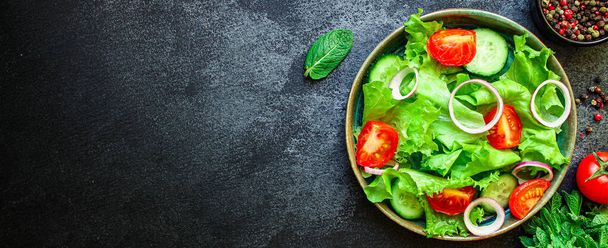 Healthy salad, leaves mix salad (mix micro greens, cucumber, tomato, onion, other ingredients). food background. copy space for text keto or paleo diet - Photo, Image