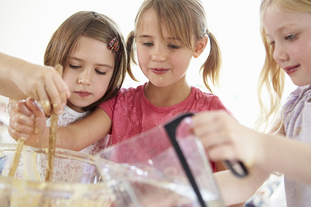 Three Girls Making Cupcakes In Kitchen - Valokuva, kuva