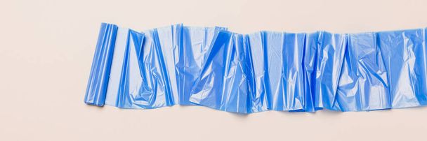 rolled up plastic bag, long banner, copy space - Фото, изображение