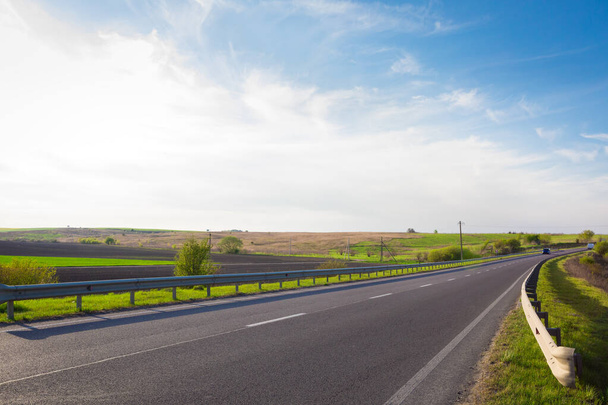 speed highway through the field. asphalt-paved road - Fotó, kép