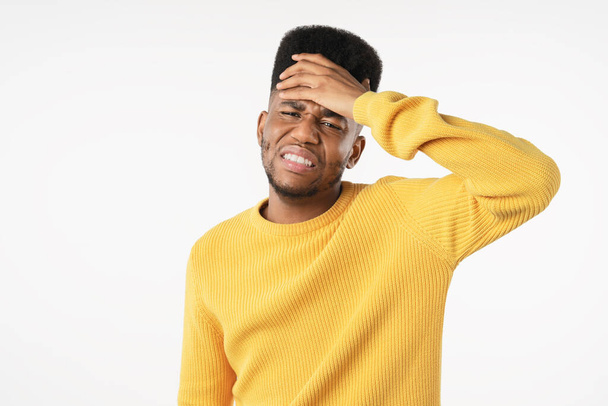 Young man with disgusted expression repulsing something over white background - Fotoğraf, Görsel