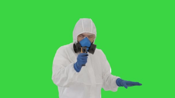 James Bond parody Doctor checking temperature on a Green Screen, Chroma Key. - Felvétel, videó