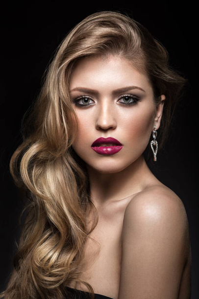 Beautiful girl with red lips and classic makeup and curls. Beauty face - Фото, изображение