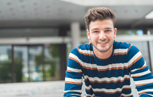 Close-up of positive young man smiling. Handsome happy guy, Happiness concept - Zdjęcie, obraz