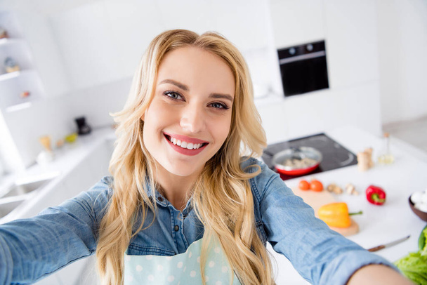 Hello dear followers. Closeup photo of beautiful housewife making selfies recording video vlog cooking blogger tasty vegan meal quarantine stay home time kitchen indoors - Photo, image
