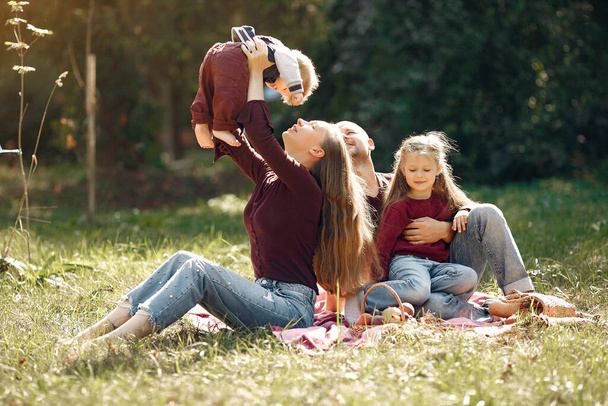 Family with cute kids in a autumn park - Fotografie, Obrázek