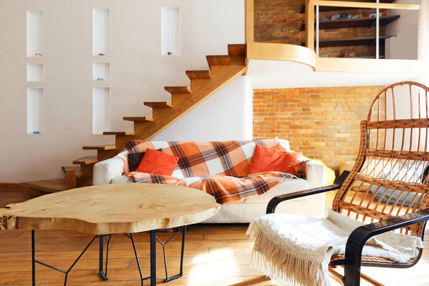 Modern cozy loft. Chair, table and sofa - Photo, Image