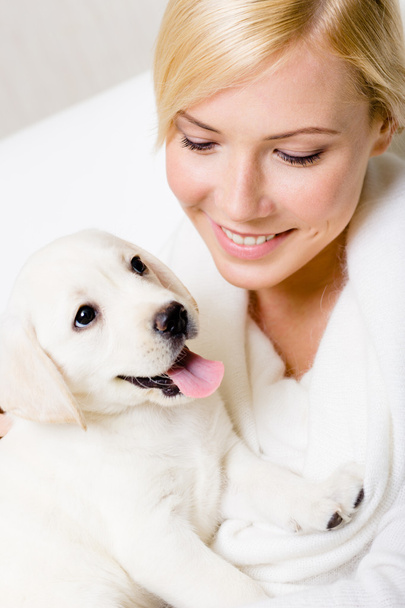 Portrait of woman with Labrador puppy - Foto, Imagen