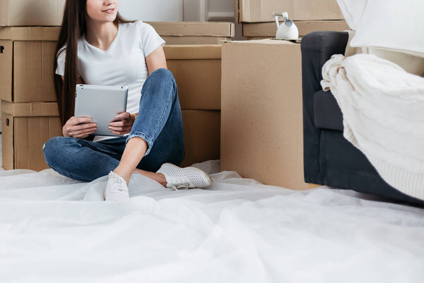 young woman making online purchases for her new apartment - Photo, image