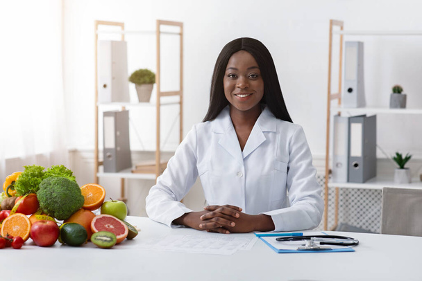 Beautiful female dietician posing at her modern office - Photo, Image