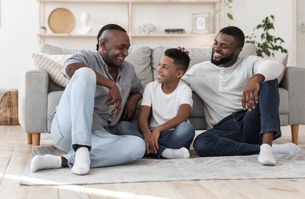Portrait of african grandfather, father and son bonding together at home - Valokuva, kuva