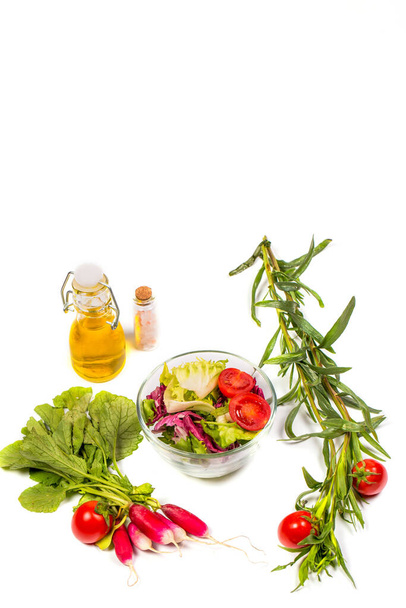 Fresh spring vegetables, salad, spices on a white background - Фото, изображение