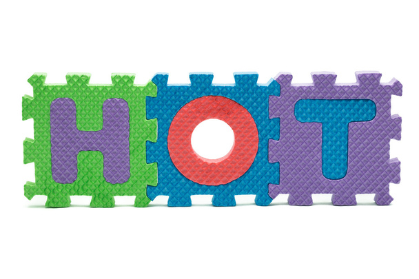 forró a Word és az elszigetelt fehér hab színes puzzle-játék - Fotó, kép