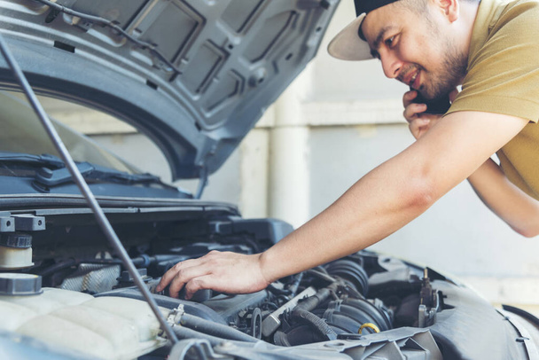 Mechanic Car Service in automobile garage auto car and vehicles service mechanical engineering. Automobile mechanic hands car repairs automotive technician workshop center. Services car engine machine - Photo, Image