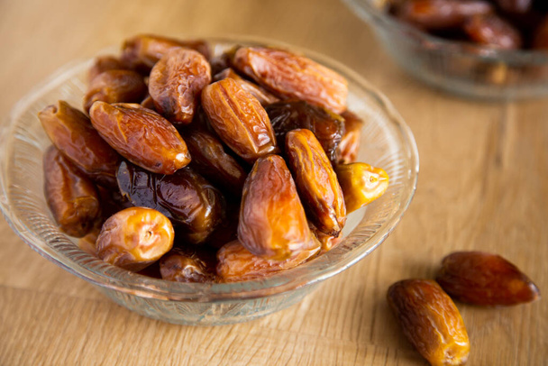 Kurma or dates on wooden background prepared for Ramadan - Photo, Image