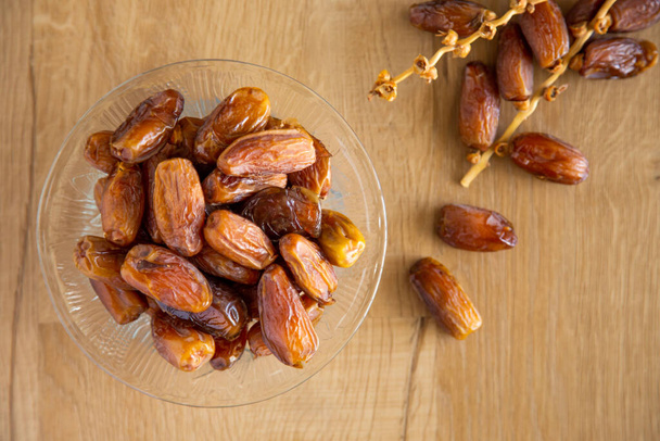 Kurma or dates on wooden background prepared for Ramadan - Photo, Image
