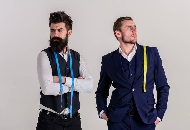 Man with beard in waistcoat and young tailor in suit. - Fotoğraf, Görsel