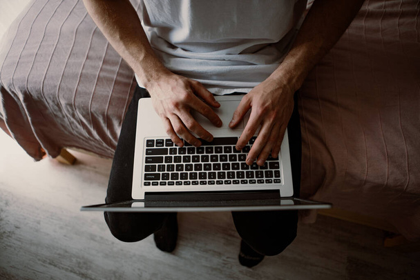 shot of male hands typing on a laptop - Fotó, kép